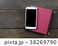 Empty screen mobile on red cover book and pencil  38269790