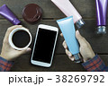 Hand of Asian man holding empty cosmetic tube  38269792