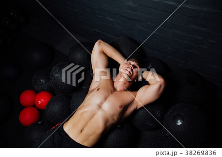 Portrait of a muscular man resting and lying on Portrait of a muscular man resting and lying on 38269836