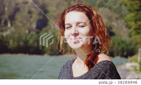 Portrait of young beautiful smiling woman with red Portrait of young beautiful smiling woman with red 38269946