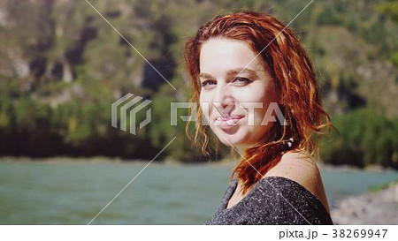 Portrait of young beautiful smiling woman with red Portrait of young beautiful smiling woman with red 38269947