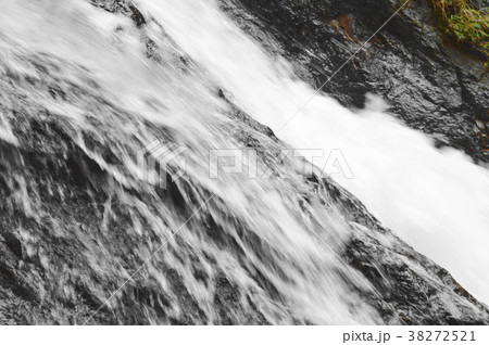 waterfall falling and hit rock splashing to river 38272521