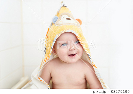 Happy toddler covered with towel Happy toddler covered with towel 38279196
