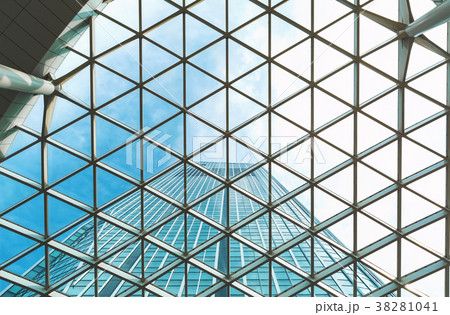 Looking up at a skyscraper and the sky above 38281041