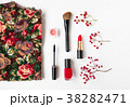 Woman cosmetics and top decorated. Flat lay in red 38282471
