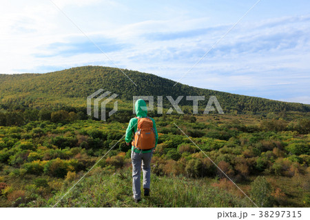 hiking woman walking in the autumn forest 38297315