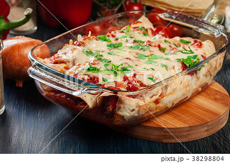 Traditional mexican enchiladas with chicken meat 38298804