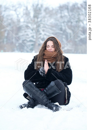 woman meditating in winter woman meditating in winter 38302168
