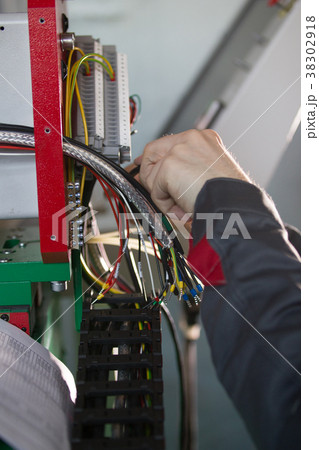 Hands of electrician engineer switching and Hands of electrician engineer switching and 38302918