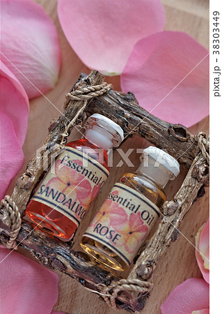 Bottles of Rose Essence with Petals Bottles of Rose Essence with Petals 38303449