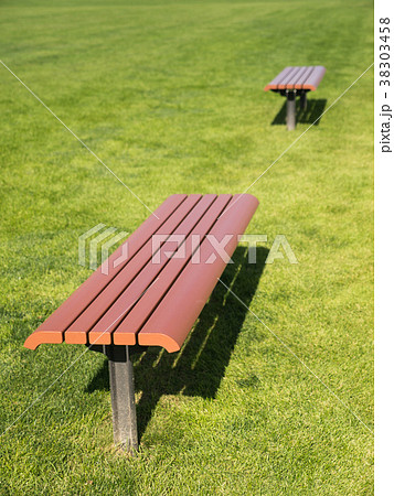 Side View of The Brown Long Chair on The Lawn Side View of The Brown Long Chair on The Lawn 38303458