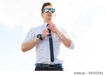 Attractive young busunessman in white shirt, tie 38305391