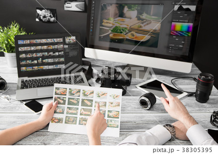 Photographers computer with photo edit programs. 38305395