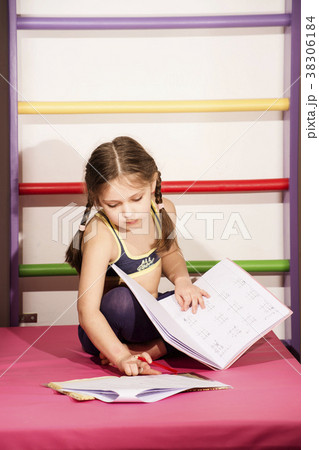 Little caucasian 6-8 years old girl doing one's 38306184