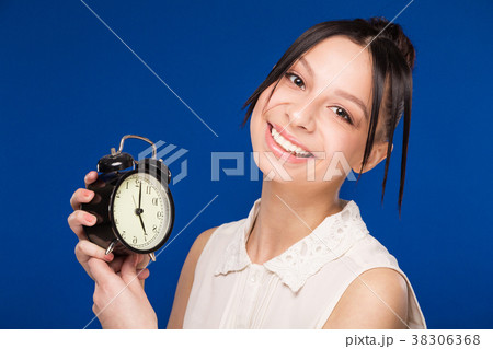 girl  with an alarm clock 38306368
