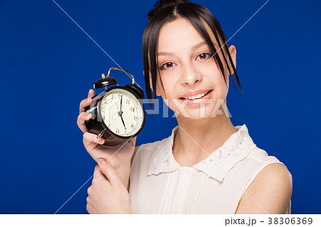 girl with an alarm clock girl with an alarm clock 38306369