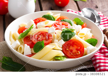 Pasta salad with fresh red cherry tomato and feta 38306521