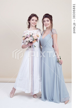 two adorable women wearing in long fashionable two adorable women wearing in long fashionable 38306881