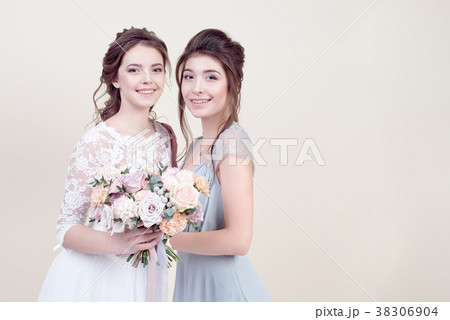 two adorable women wearing in long fashionable two adorable women wearing in long fashionable 38306904