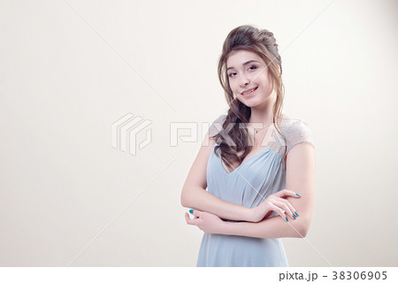 Cute young lady wearing in luxurious long lacy Cute young lady wearing in luxurious long lacy 38306905