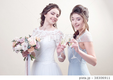 two adorable women wearing in long fashionable two adorable women wearing in long fashionable 38306911