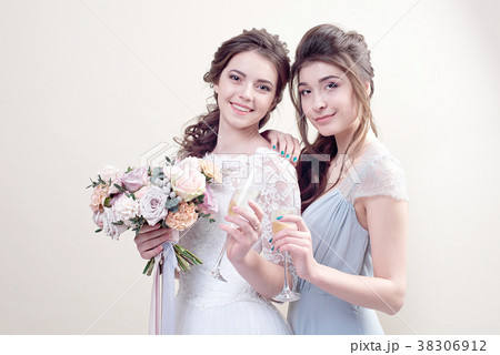 two adorable women wearing in long fashionable two adorable women wearing in long fashionable 38306912