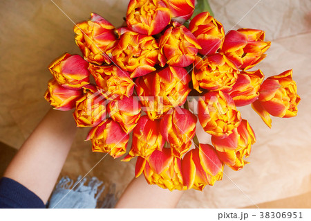Fresh, red and yellow bouquet of flowers in a 38306951
