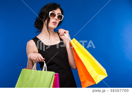 girl in glasses with packages 38307700