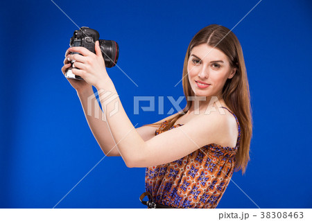 girl with a camera in his hands 38308463