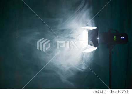 Smoke in backlight. Studio lighting. Studio flash. 38310251