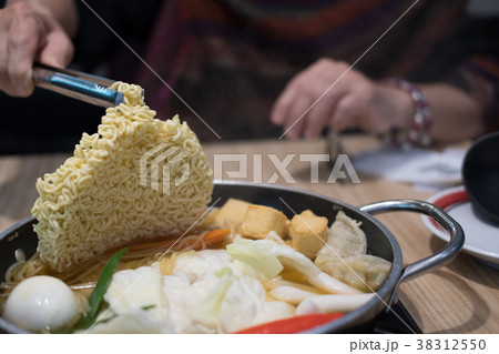 tokpokki traditional korean food. noodle, egg, vegetable and meat in hot pot in restaurant 38312550