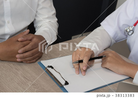 doctor explaining to patient about diagnosis at hospital. physician talk & give advice to man about his health at medical office doctor explaining to patient about diagnosis at hospital. physician talk & give advice to man about his health at medical office 38313383