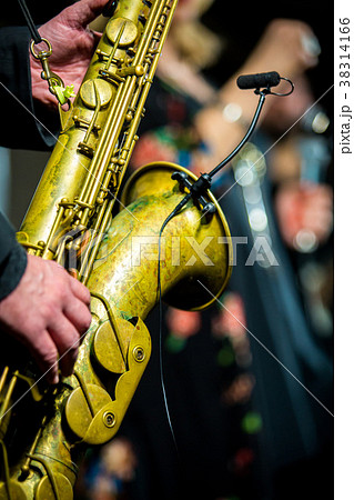 Saxophone player performing on the stage Saxophone player performing on the stage 38314166