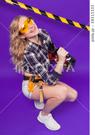 Pretty builder girl in chechered shirt, glasses Pretty builder girl in chechered shirt, glasses 38315335