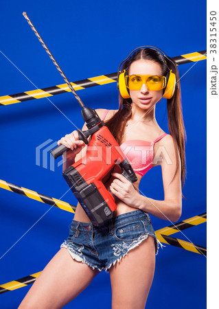 Attractive sexy builder girl in pink bikini, denim 38315450