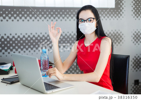 Pretty, young businesslady in red dress, gas mask Pretty, young businesslady in red dress, gas mask 38316350
