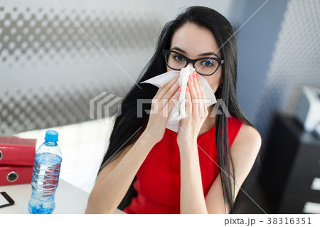 Pretty, young businesslady in red dress and Pretty, young businesslady in red dress and 38316351