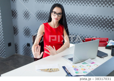Young attractive businesslady in red dress and 38317031