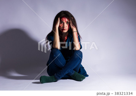 Rape battered bloody victim sad woman sits on the 38321334