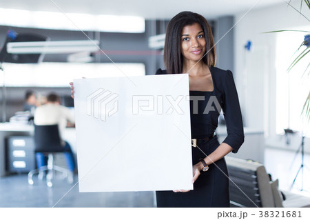 Pretty, young business lady in black strong suite 38321681