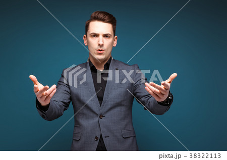 Young handsome businessman in grey jacket and Young handsome businessman in grey jacket and 38322113