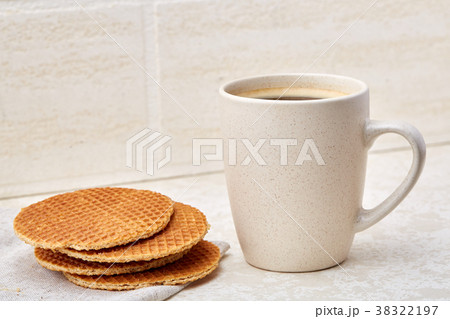 Cup of coffee and biscuit isolated on the white 38322197