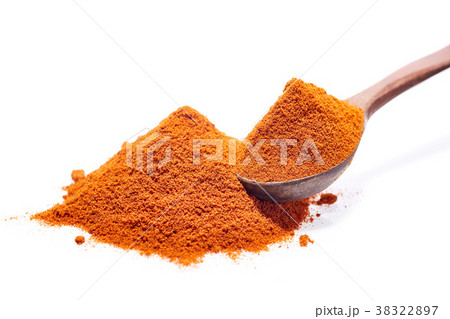 Wooden spoon full of paprica isolated on white 38322897