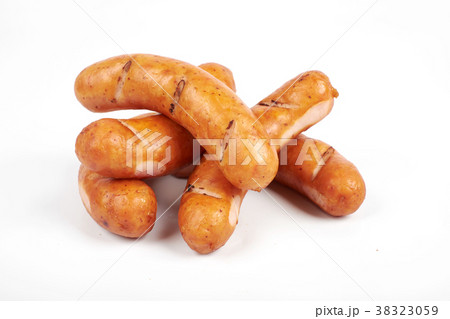 Grilled chicken sausages isolated on a white Grilled chicken sausages isolated on a white 38323059