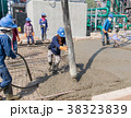 Workers at the construction site placing concrete 38323839