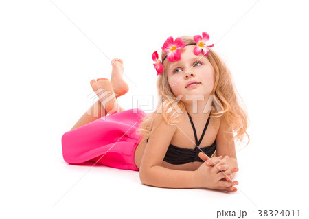 Attractive little girl in black bikini, pink skirt 38324011