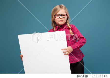 Adorable little girl in pink shirt, black trousers 38325516