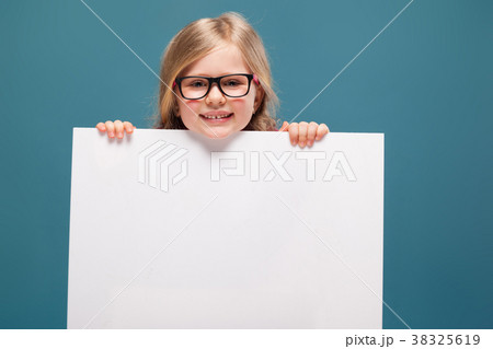 Adorable little girl in pink shirt, black trousers Adorable little girl in pink shirt, black trousers 38325619