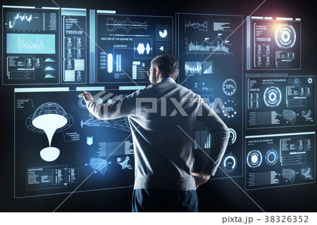 Professional programmer standing alone and looking Professional programmer standing alone and looking 38326352
