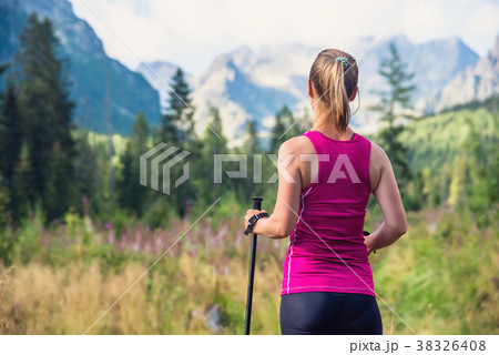 Young woman hiking in the mountains 38326408